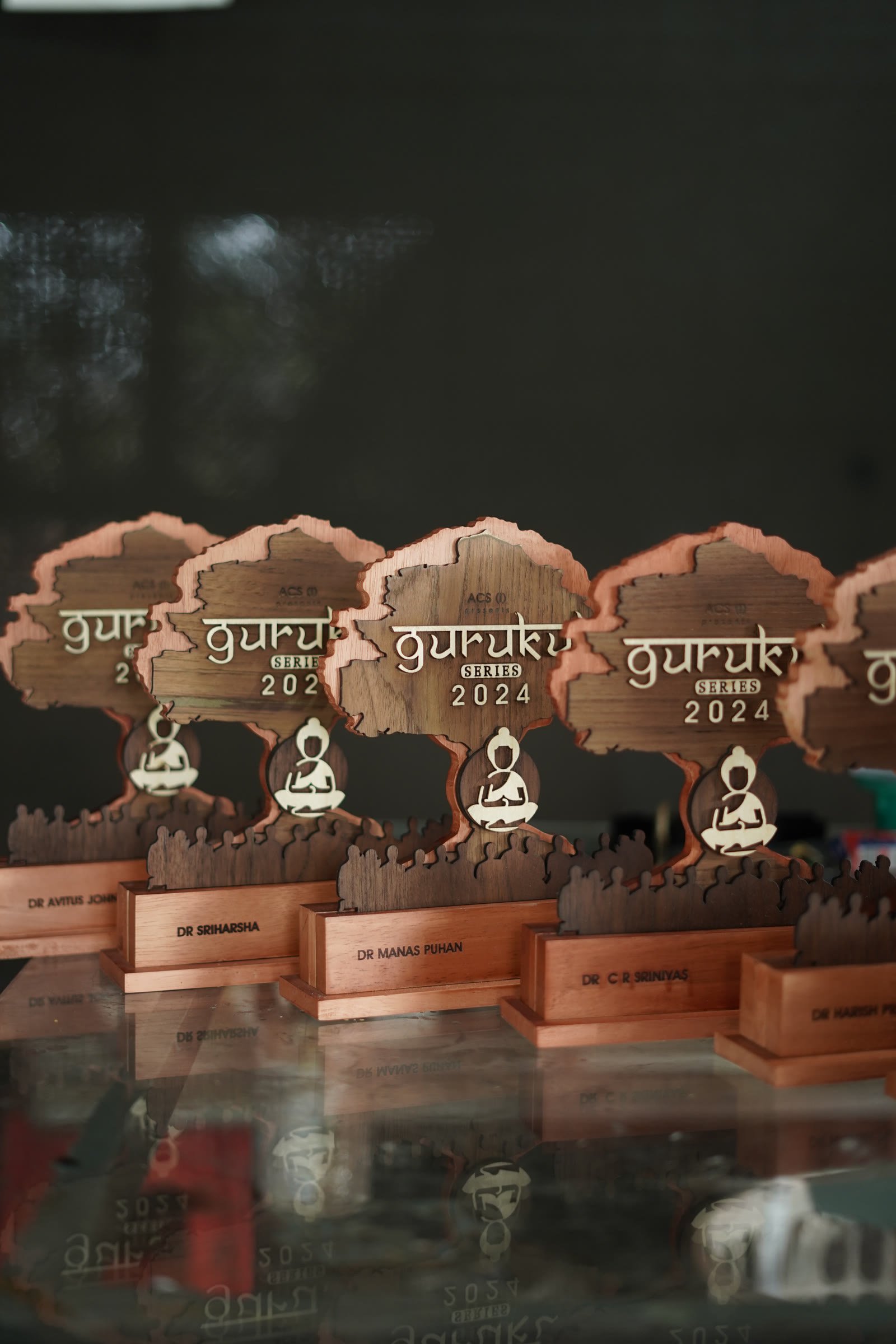A series of custom wooden Guru awards