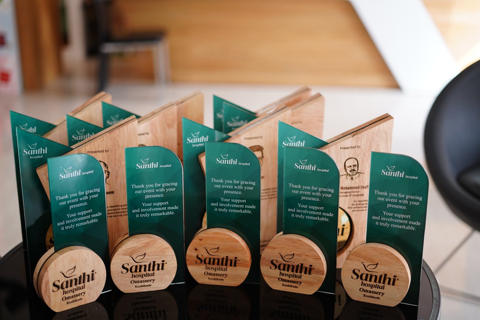 A coordinated series of green and wooden recognition awards